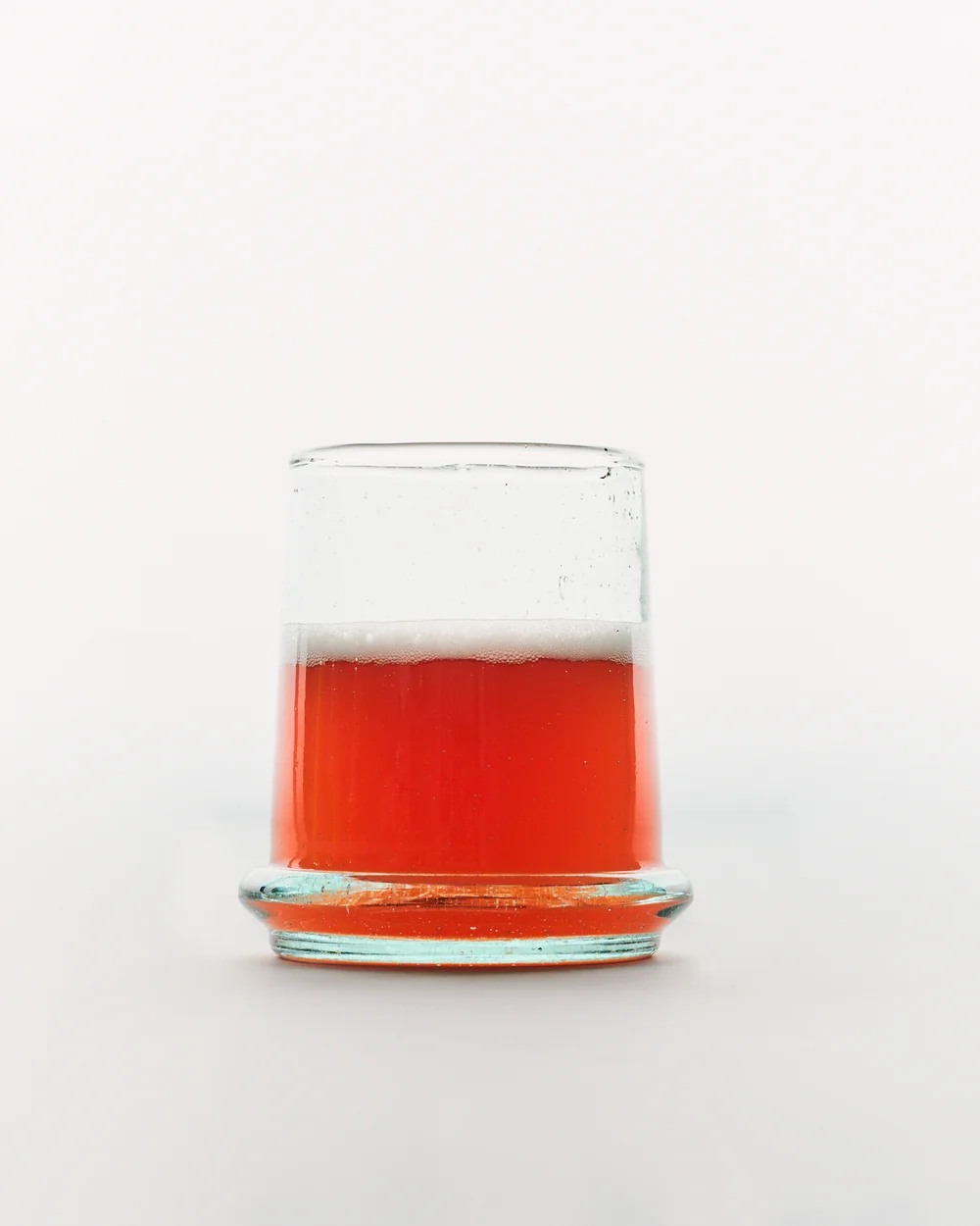 A small glass of dulse kombucha