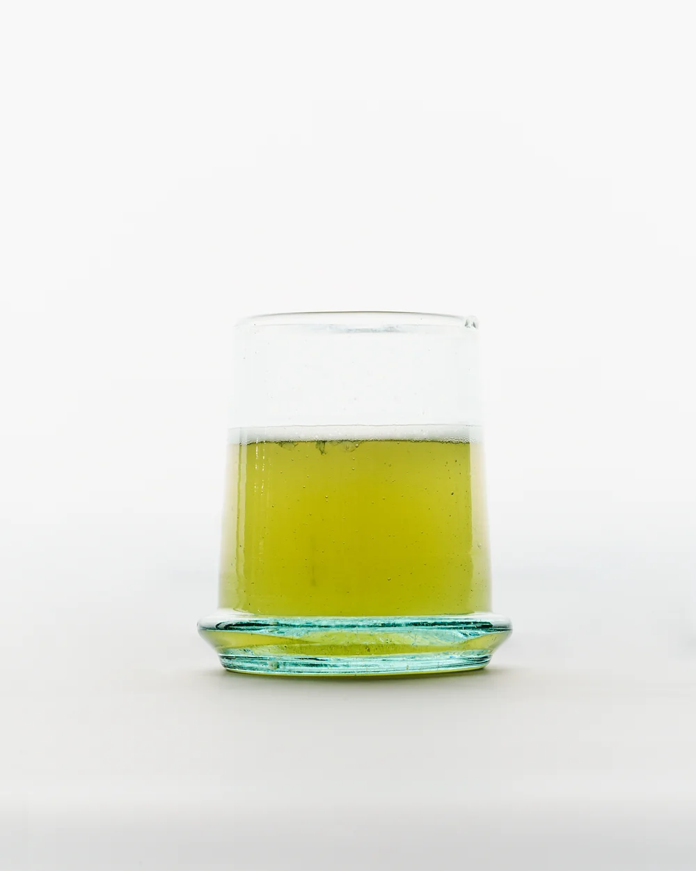 A small glass of sea lettuce kombucha